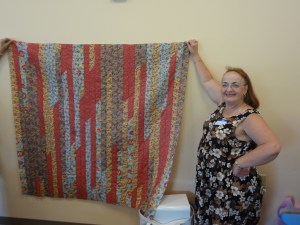 The beautiful, romantically colored strip quilt